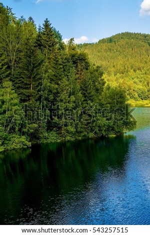 Lake in the mountains. Mountain landscape with lake.