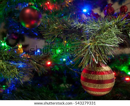 Christmas tree with spheres and colored lights, on the eve of the holiday celebration and new year