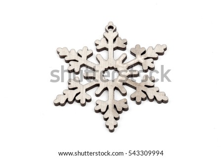 Gorgeous white wooden decoration - snowflake/ star. Adorable winter, Christmas, New Year, event decor made from solid wood. Isolated on white background. Side view. Closeup.
