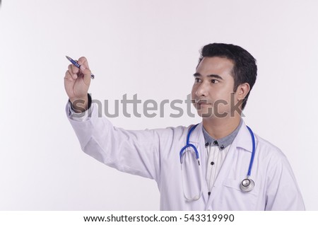 male medical doctor writing on blank space, standing isolated on white background.