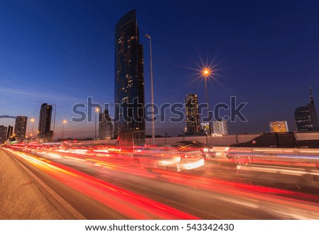 The light trails on the street and urban at dusk as city life background.