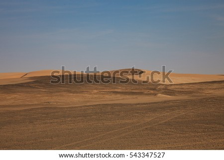 view from the road to the African dunes in the desert near the ocean. Namibia, South Africa