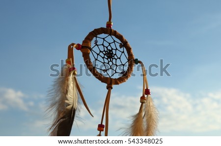 Net circle of dream catcher on soft blue sky and white background