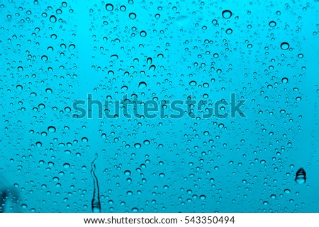 abstract water drop on windshield or water drop on sky background.