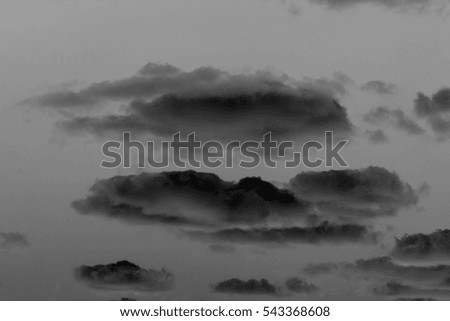 Black clouds on a dark background