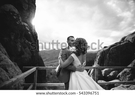 wedding couple walking in the mountains