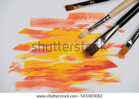 Brush strokes and palette knife oil paint red and yellow colors on a white background