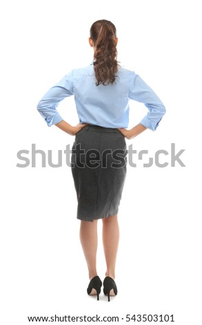 Young businesswoman standing back on white background