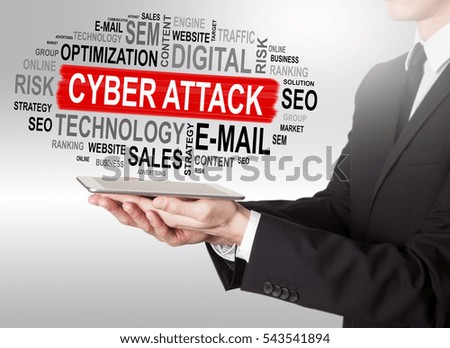 Cyber Attack concept, young man holding a tablet computer