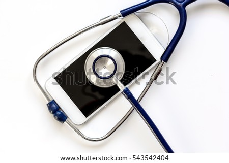 diagnostic of gadgets on white background with stethoscope top view
