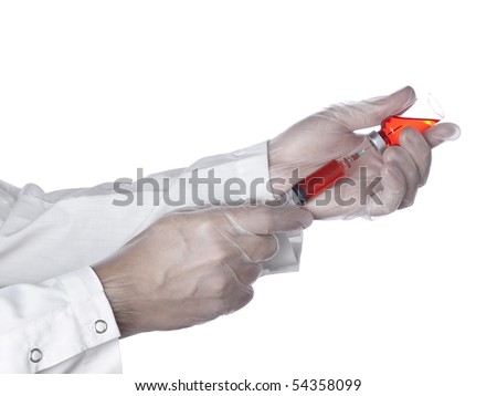 A doctor is taking a dose of a red medicine out of the vial. Royalty-Free Stock Photo #54358099