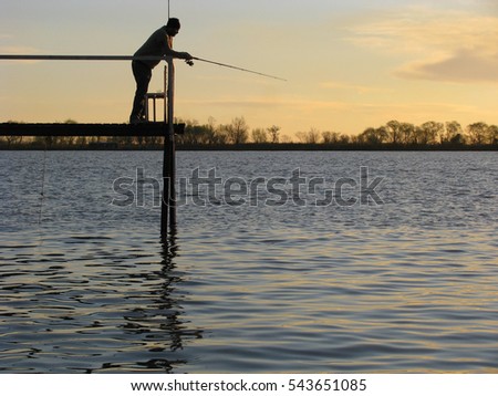 Man fishing at Parana river in Buenos Aires, Argentina
