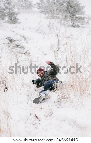 Male photographer taking pictures in winter environment