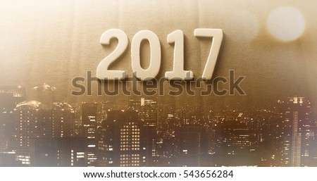 Double exposure of city and happy new year 2017 alphabet with bokeh