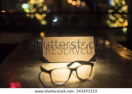 Gold plate reserve and glasses. Stylish photo with glasses