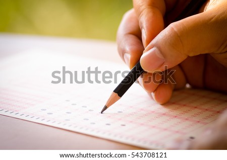 Pencil drawing selected choice on answer sheets Royalty-Free Stock Photo #543708121