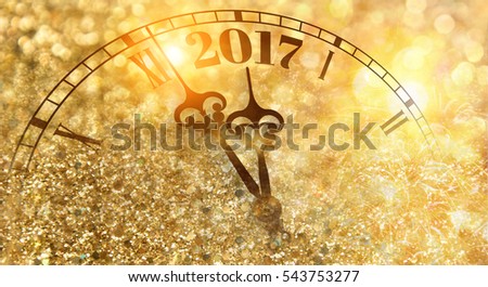 New year clock counting down and sparkler Royalty-Free Stock Photo #543753277