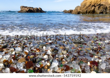 colorful glass pebbles blanket this beach in Fort Bragg, the beach was used as a garbage dump years ago, nature has tumbled the glass and polished it making it a tourist destination