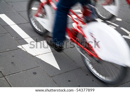 Speedy cyclist commuting on an urban cycleway.