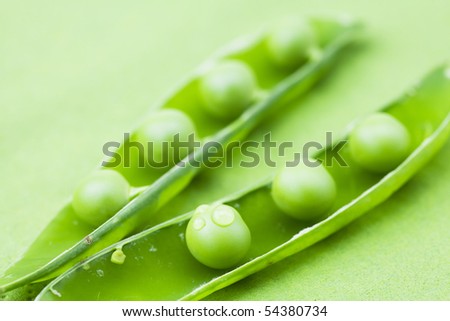 peas on a green background