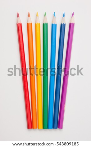 Pencils of different colors on white background