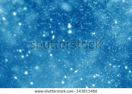 Abstract round blue bokeh or glitter lights on festive background. Circles defocused particles 