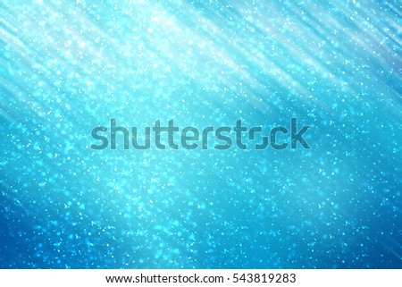 Abstract round silver bokeh or glitter lights on blue background. Circles defocused particles and rays