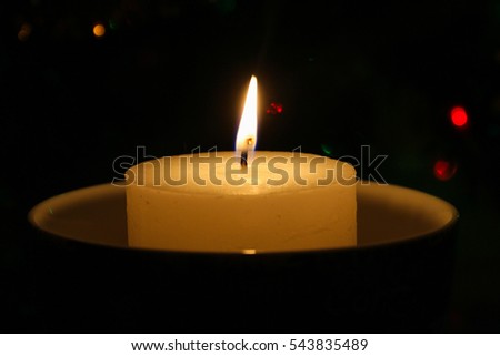 POLTAVA, UKRAINE - Candle when burning (one of the symbols of the celebration of Christmas and New Year)