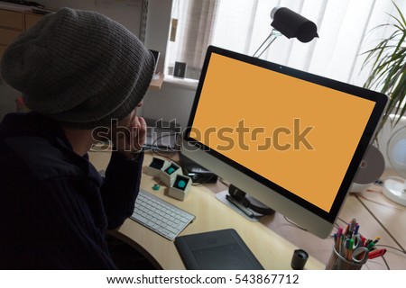 Video editor / animator sits in front of a digital screen and tries to think about what project to work on next