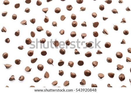Scattering of tasty chocolate chips on white background Royalty-Free Stock Photo #543920848