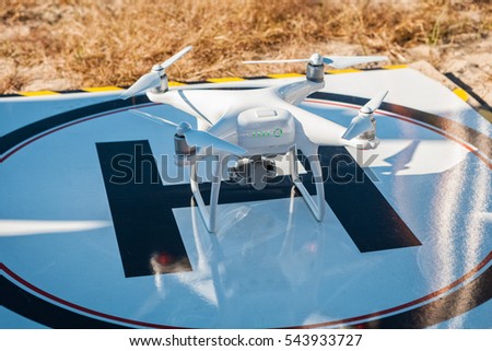 Quadrocopter prepares for fly. New unmanned aerial copter.