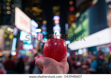Having an apple in the Big Apple  Royalty-Free Stock Photo #543948607