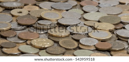 Side view of many old coins