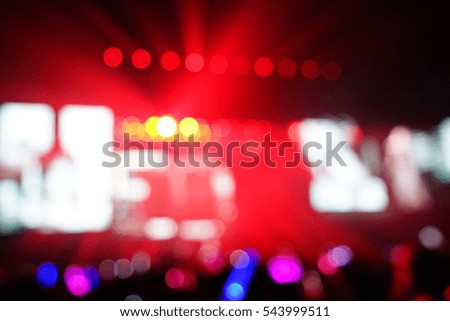 Defocused entertainment concert lighting on stage, blurred disco party.
