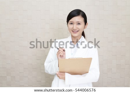 Smiling Asian pharmacist
