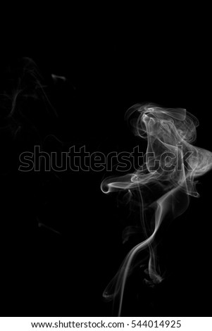 Abstract art. Gray smoke from the incense on a black background. Background for Halloween. Texture fog. Design element. The concept of aromatherapy.