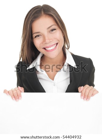 Business woman showing blank sign board. Asian busineeswoman in suit presenting billboard isolated on white background. Young Asian / Caucasian female model.