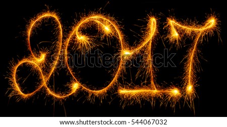 Happy New Year - 2017 made by sparklers on black background