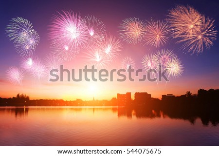 Silhouette city urban communities with soft focus sunset and colorful fireworks background. Blurred blue purple sky peaceful glow bright during twilight. Outdoor water open view. Landscape celebration Royalty-Free Stock Photo #544075675