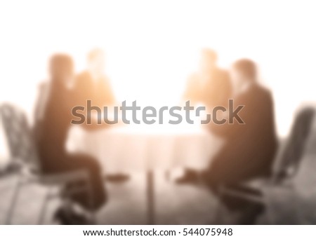 Abstract blur conference room of administrators and teacher. Meeting event planning and taught at the university,primary level. Blurry public business conventions background brown sepia tone.