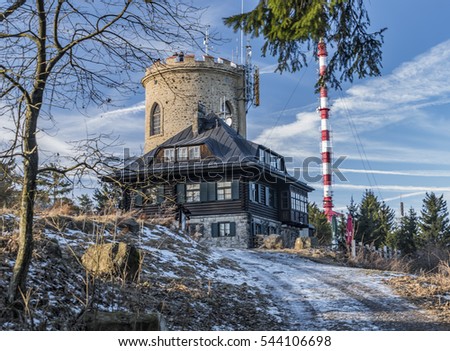 Klet mountain in winter sunny day with observation transmitter and view on Alps