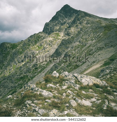 Tatra mountains in Slovakia covered with clouds. peak of krivan - instant vintage square photo