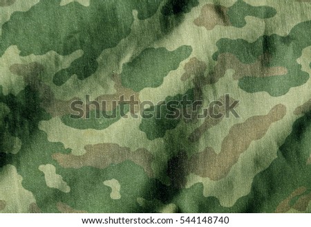 Camouflage cloth surface. Abstract background and texture for design and ideas.