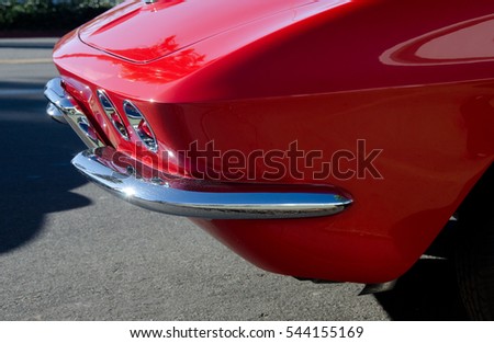 Elements of a red classic car parked in Southern California village near San Diego