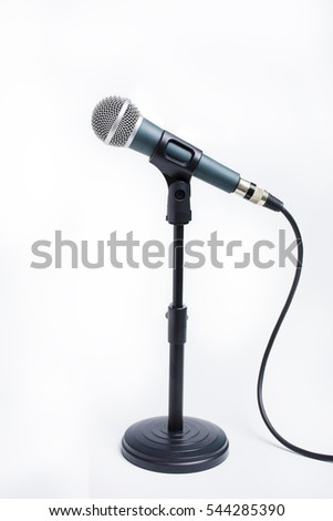 dynamic microphone on stand isolated on white background. Sound recording hardware, audio equipment for studio and concert Royalty-Free Stock Photo #544285390
