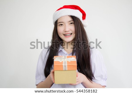 Portrait of thai china high school student uniform beautiful girl hold gift box in hands