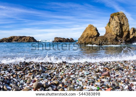 colorful glass pebbles blanket this beach in Fort Bragg, the beach was used as a garbage dump years ago, nature has tumbled the glass and polished it making it a tourist destination