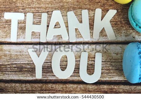 Sweet thank you. Thank you word with macaroons on wooden background. Thank you wooden word. Rustic thank you. 
