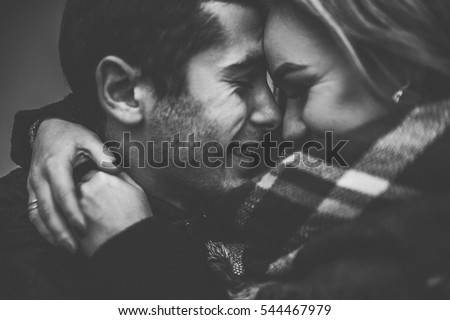 Lovely happy couple.romantic black and white photo.Hugs together and smile 