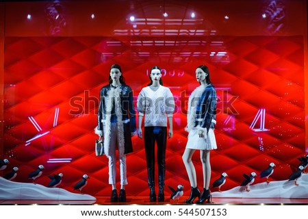 mannequins standing in the shop window Display casual clothing store in the Mall. Royalty-Free Stock Photo #544507153